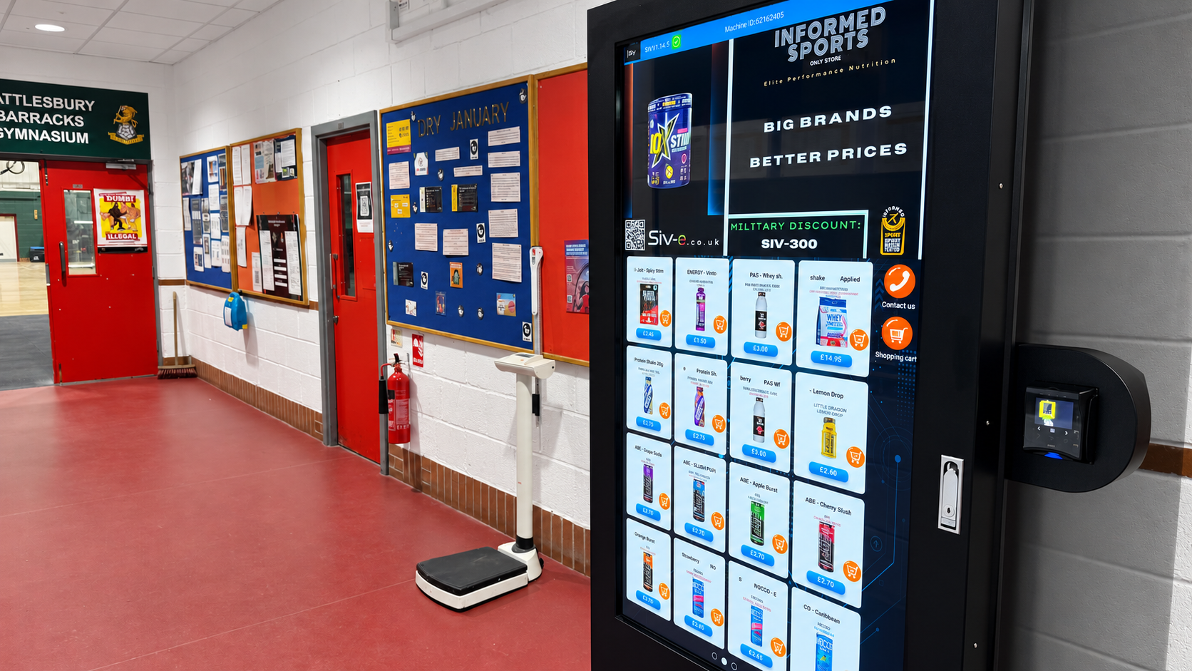 SIV interactive vending machine and contactless payment reader in a gym corridor.